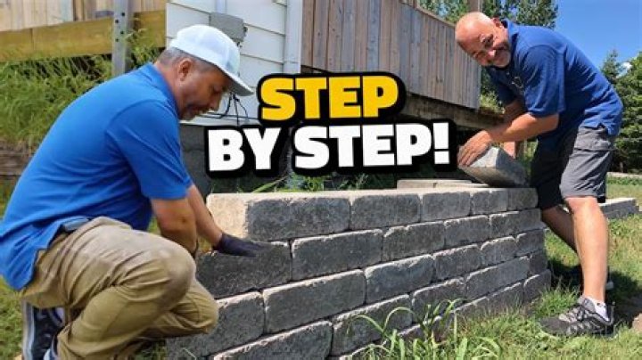 How do you build a wall with pavers?