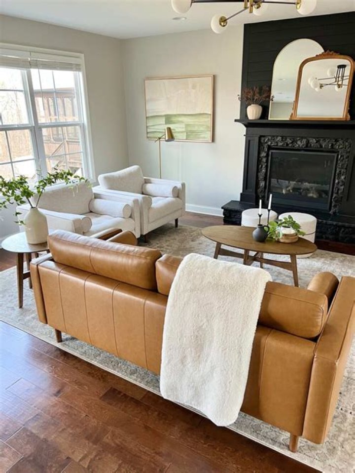 How do you decorate a living room with a leather sofa?