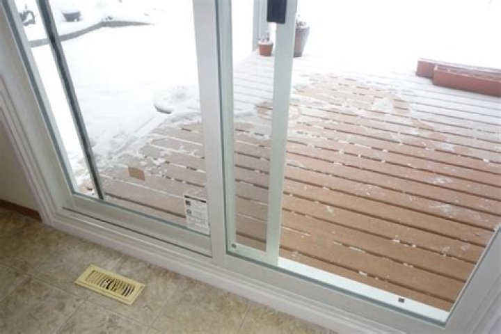 How do you keep a sliding glass door from freezing?