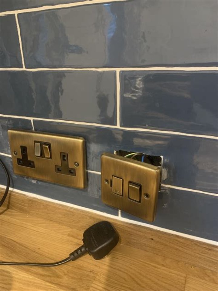 How do you wallpaper around plug sockets?