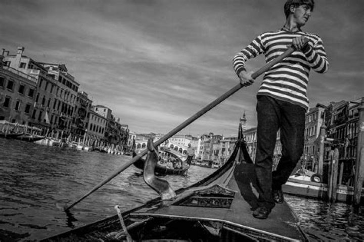 Who are gondoliers and what do they do?